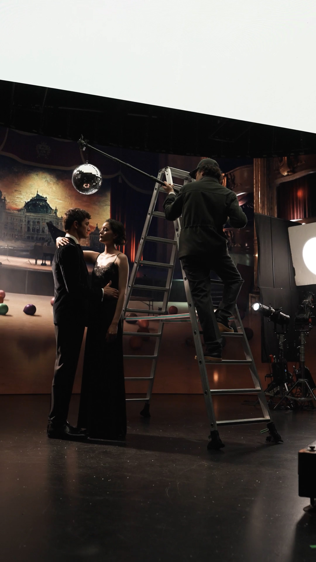 The couple and crew on the theatrical set