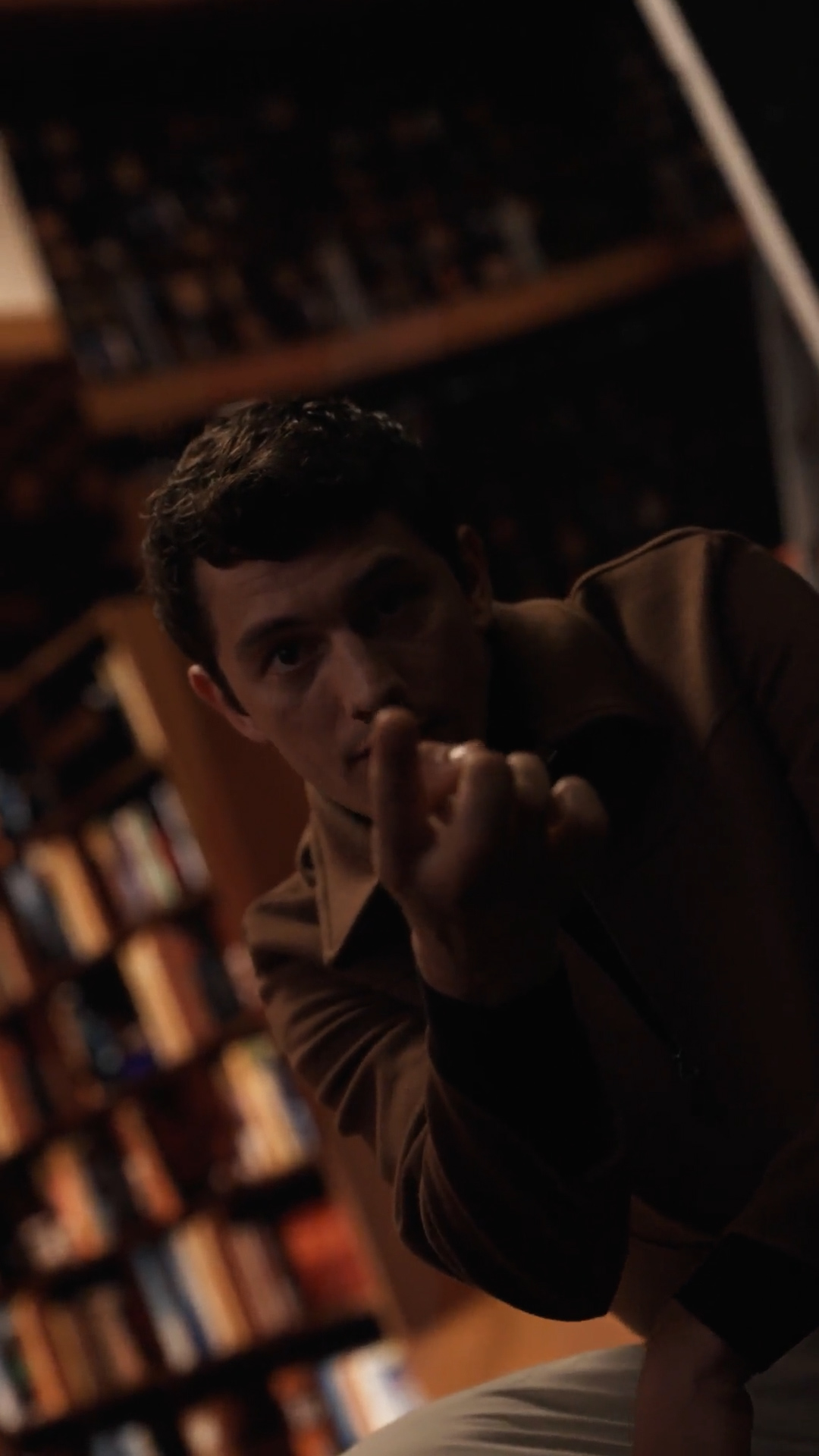 The writer among the bookshelves